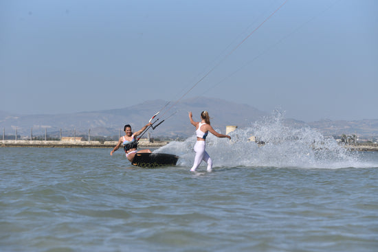 kitesurfers having fun in the water